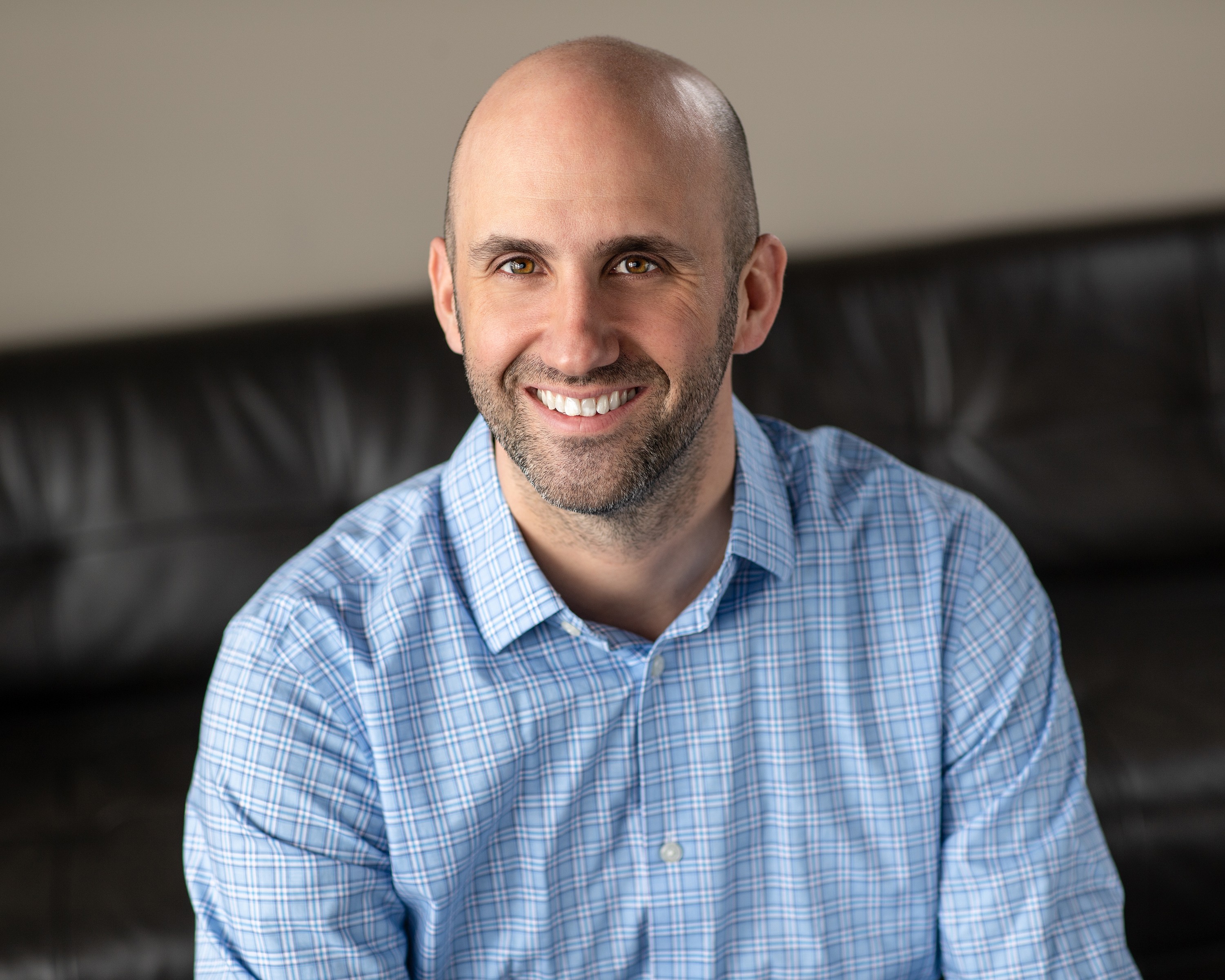 Professional headshot of the founder